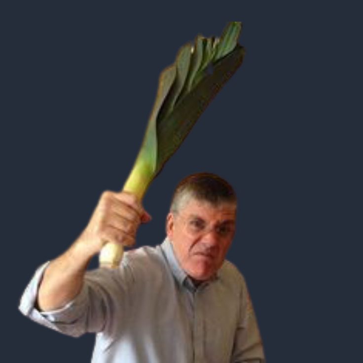 a man holding up a large green plant