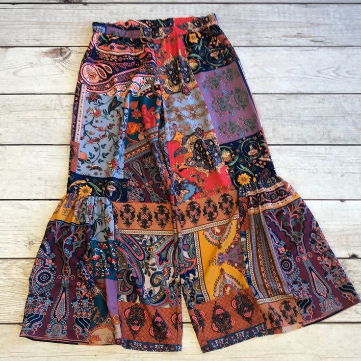 Tolani Boho Pants Are A Great Colorful, Boho Party Pant. Lightweight Rayon Fabric With Stylish Wide Legs And A Stretchy Waist. These Pants Run Large. They Are Marked M, But The Fit Is L. The Waist Measurement: 32.” Last Two. Open To Offers! Patterned Wide Leg Beach Bottoms, Multicolor Boho Print Bottoms For Vacation, Vacation Boho Print Patterned Bottoms, Multicolor Boho Print Summer Bottoms, Patterned Wide Leg Bottoms With Elastic Waistband, Patterned Boho Print Bottoms For Summer, Fitted Casual Bottoms With Boho Print, Patterned Bottoms With Boho Print For Summer, Casual Fitted Bottoms With Boho Print