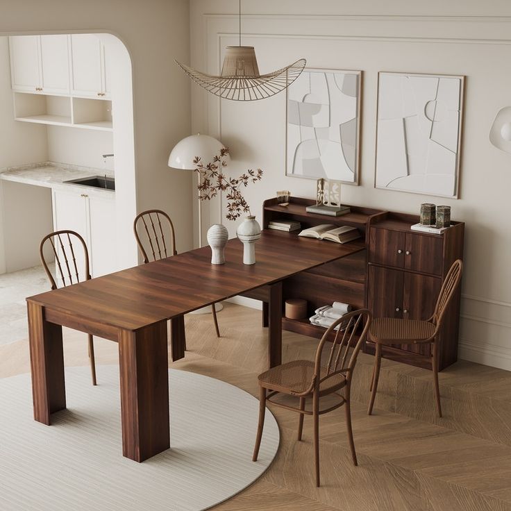 a wooden table sitting in the middle of a living room next to a white rug