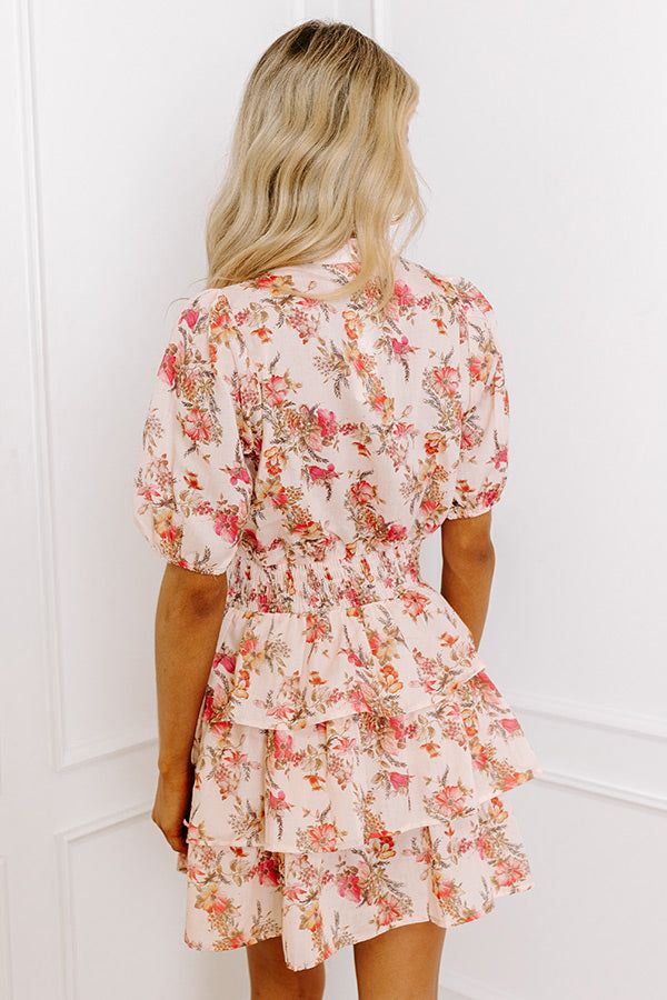 - This mini dress is perfect for a romantic lunch date with your sweetheart! - Unlined lightweight material with a pink, yellow, and orange hued floral design - A v-cut neckline that goes into a button-down bodice - Short sleeves with elastic cuffs - A wide smocked waistline - A tiered skirt - A figure flattering silhouette that ends in a straight mini dress length hemline Measurements S : Bust 36", Hip 36", Length 31.5", Sleeve Length 12", Waist 24-36". M : Bust 38", Hip 38", Length 31.5", Slee Pink Floral Print V-neck Mini Dress, Casual Peach Mini Dress With Floral Print, Peach V-neck Dress For Brunch, Peach Floral Print Mini Dress For Garden Party, Apricot V-neck Mini Dress For Summer, Summer V-neck Mini Dress In Apricot, Feminine Apricot Dress With Floral Print, Summer V-neck Apricot Mini Dress, Feminine Apricot Floral Print Dress