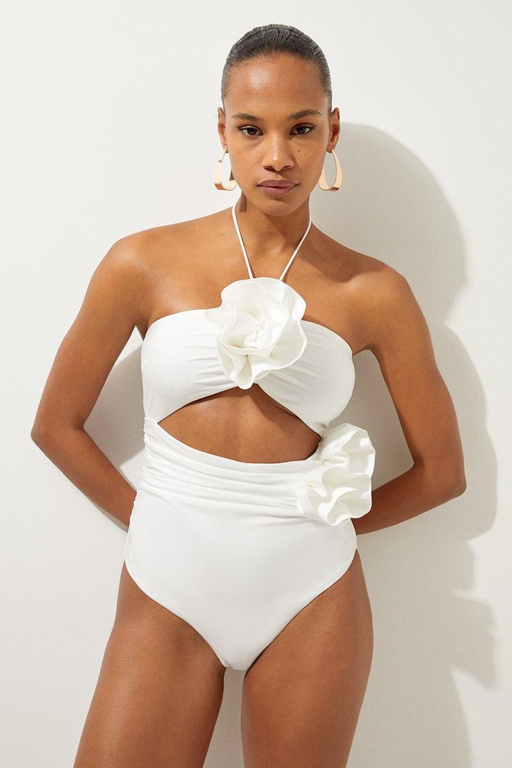 Rosette Cut Out Detail Swimsuit - Cream - Welcome the sun with a swimming costume that will turn heads, featuring a three dimensional corsage accent on the bust and hip, and a statement cut out design in the front and back. Style this piece with strappy sandals and a beach cover up for a holiday look that can be reworn time and time again. Rosette Cut Out Detail Swimsuit Flattering Halter Neckline Unique, Three Dimensional Flower Accent Statement Cut Out Design Tie and Clasp Fastening in Back Elegant Bathing Suits, One Piece Swimsuit Outfit Cover Up, Bali Outfits, Wedding Swimsuit, Bridal Swimsuit, Hen Do Outfits, Petite Wedding Guest Dresses, Workwear Capsule Wardrobe, Flower Swimsuit