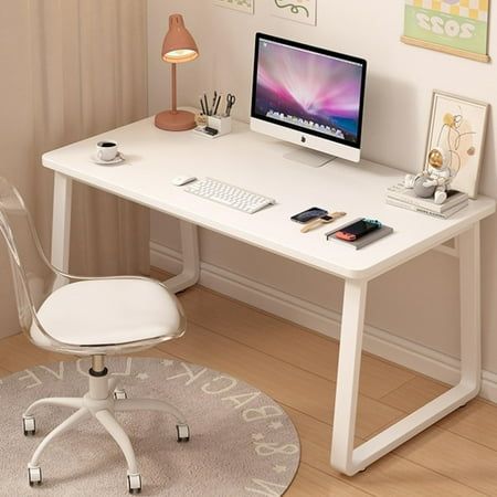 a white desk with a computer on it