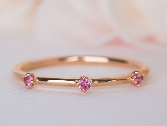 A pink wedding band, a beautiful pink Sapphire ring, unique crown pink Sapphire 14K/18K ring, an alternative wedding ring, pink Sapphire band.This aristocratic crown pink Sapphire ring is delicate and timeless. it is inspired by the French era and brings a classic yet unique look you will love and cherish for years to come.Our vintage floral collection is here to offer you a timeless piece, that your fiance will love and cherish for years to come. As it will allow her to relive your love every t Pink Sapphire Round Band Wedding Jewelry, Pink Sapphire Round-cut Wedding Ring, Pink 14k Gold Stackable Round Rings, Pink Sapphire Round Cut Wedding Ring, Pink Round Band Ring For Formal Occasions, Pink Stackable Wedding Jewelry, Fine Jewelry Pink Sapphire Wedding Ring, Pink 14k Gold Round Band Jewelry, Pink 14k Gold Stackable Rings For Anniversary