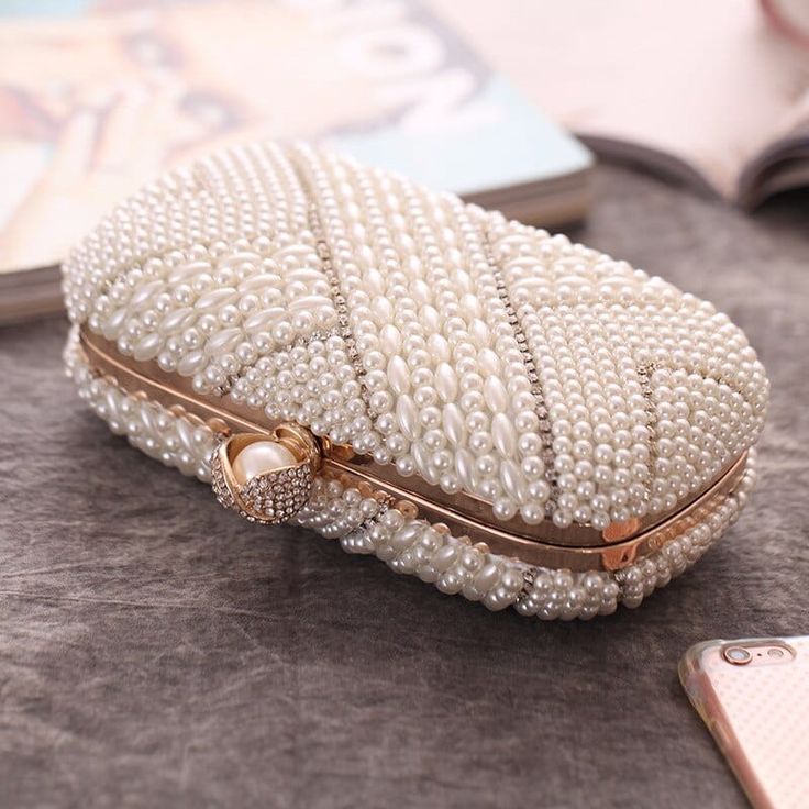 Item Type: Clutch Gender: Women Material: Polyester, Artificial Pearl, Metal Style: Fashion Closure Type: Hasp Size: 19 x 9.5 x 7 cm / 7.48 x 3.74 x 2.76 inch Package Includes: 1 x Pc Trendy White Handheld Evening Bag, White Rectangular Case Clutch For Formal Occasions, White Rectangular Clutch For Formal Occasions, White Rectangular Case Bag As A Gift, Elegant White Mobile Phone Bag, White Rectangular Case Bag For Gifts, White Mobile Phone Evening Bag, White Rectangular Shoulder Bag Gift, White Handheld Clutch For Party