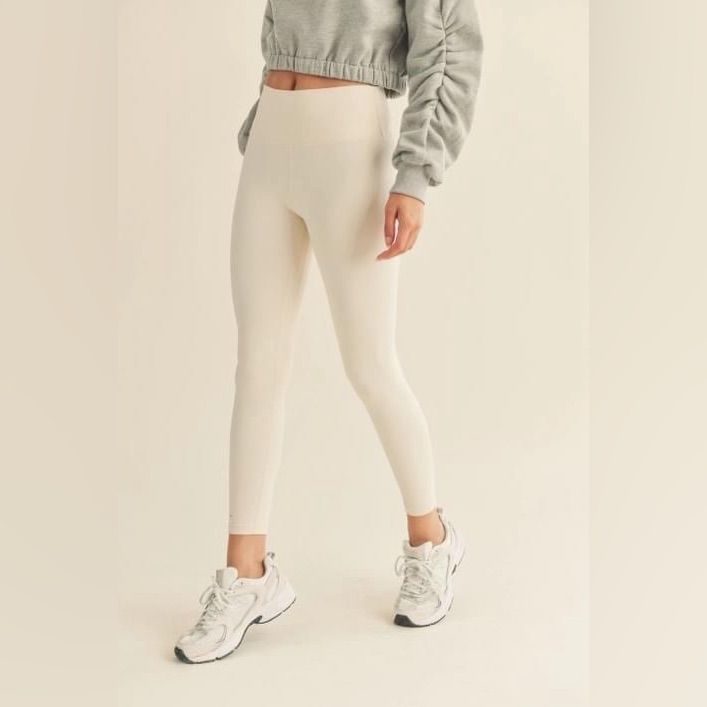 These Cream High-Rise Leggings Are A Must Have Closet Staple! Quick-Drying, Breathable And Weightless Fabric With A Butter Soft Feel And Four-Way Stretch. The Color Is A Must For Spring And Summer! Details: 75% Nylon, 25% Spandex Color Is Cannoli Cream Butter Soft Feel Wide High-Rise Waistband Inseam: S- 26" , M- 26.25" , L- 26.50" *Model's Measurements: Height 5'8.5" | Bust 34" | Waist 25" | Hips 35.5" High Waist Beige Yoga Leggings, Beige Compression Bottoms For Yoga, High Waist Beige Leggings For Yoga, Beige Compression Yoga Bottoms, Compressive Beige Yoga Bottoms, Beige High Stretch Athleisure Bottoms, High Stretch Beige Leggings, Beige High Stretch Bottoms For Athleisure, High Waist Leggings With Ribbed Waistband