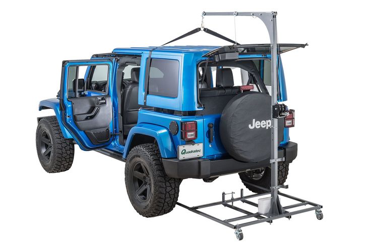 the jeep is equipped with an off - road tire carrier