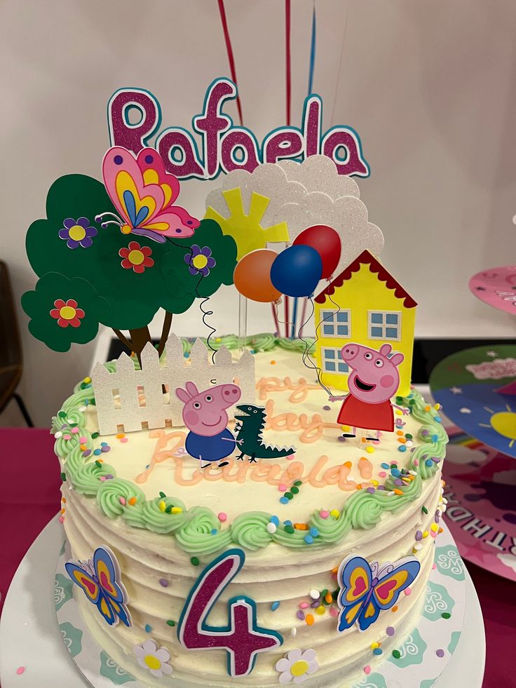 a peppa pig birthday cake with candles and decorations