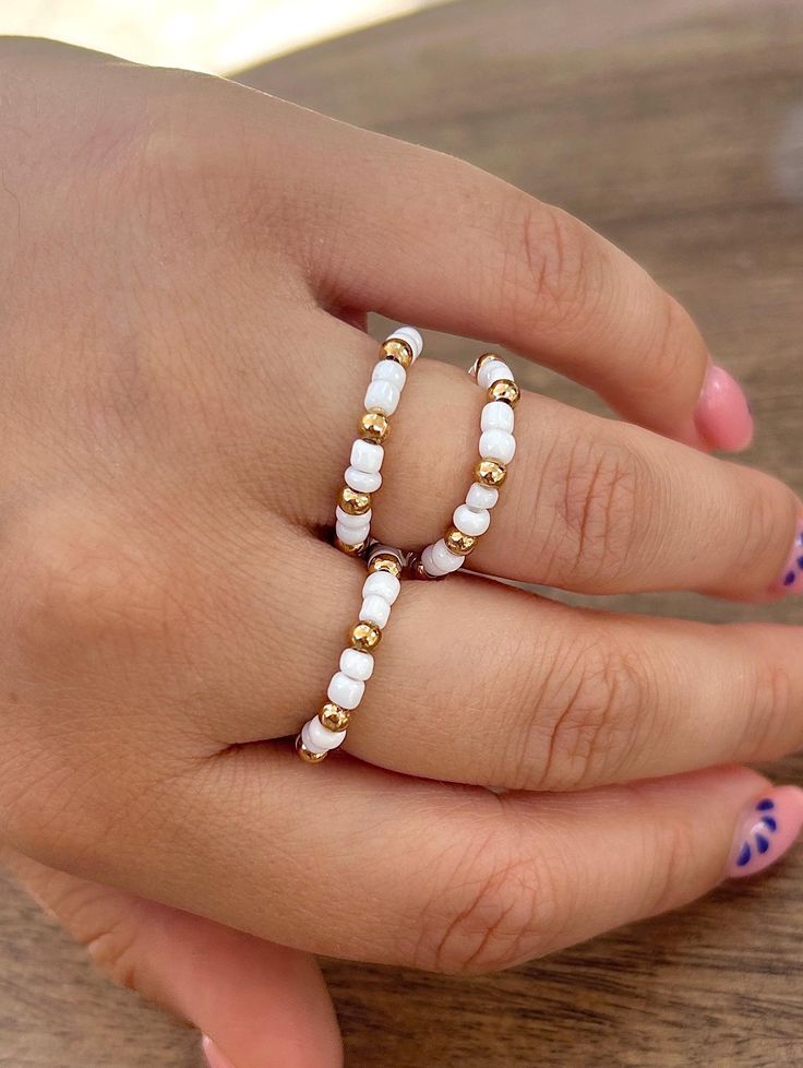 white and gold beaded ring ~ handmade elasticated beaded ring ~ gold & white beads ~ seed beach beads White And Gold Beads For Jewelry Making, White Gold Beads For Jewelry Making, White Stackable Beaded Bracelets For Jewelry Making, Adjustable Beaded Rings For Summer, White Beach Ring Jewelry, White Rings For Summer Gifts, White Rings Suitable For Summer Gifts, White Jewelry With Spacer And Round Beads, White Jewelry With Round Spacer Beads