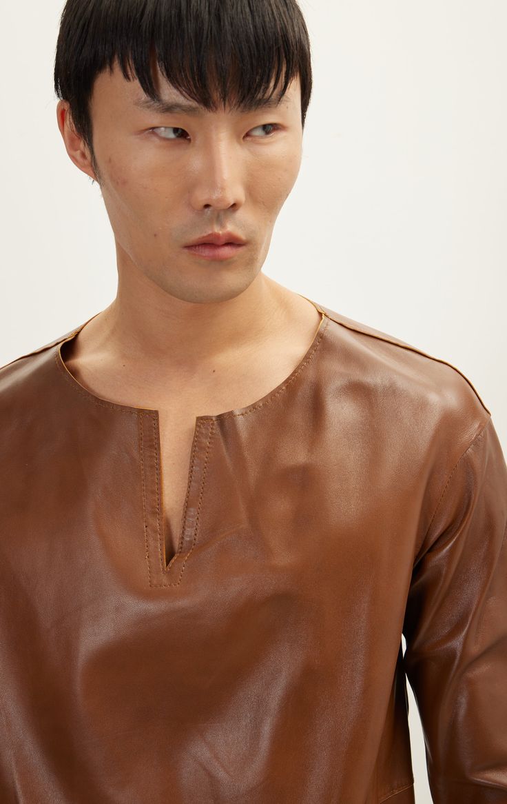 Originally part of our LA Fashion Week collection. It's a rare genuine leather three quarter V neck Shirt Due to the preciousness of the materials, leather items are handmade in our Ron Tomson manufacturing facility in small batch quantities. Luxury Brown Formal Tops, Brown Leather Long Sleeve Top, Brown Leather Top For Fall, V Neck Shirt, La Fashion Week, Jackets Men Fashion, Manufacturing Facility, Leather Pieces, La Fashion