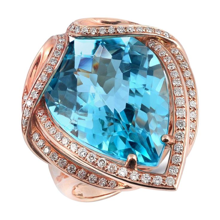 Elevate your style with this stunning designer ring. It features a captivating 20.16-carat sky blue Topaz as its centerpiece, drawing all eyes to its breathtaking beauty. The shank of the ring is an intricate work of art, twisting and turning as it ascends to securely cradle the gem. Crafted in luxurious 18K rose gold, this ring is a perfect match for the Topaz, emphasizing its natural transparency and charm. Beyond being a piece of jewelry, it's a symbol of elegance and sophistication, reflecti Ring Rosegold, 14k Rose Gold Ring, Sky Blue Topaz, Rose Gold Metal, Swiss Blue Topaz, Blue Topaz Ring, Gold Diamond Rings, Custom Engagement Ring, Diamond Sizes