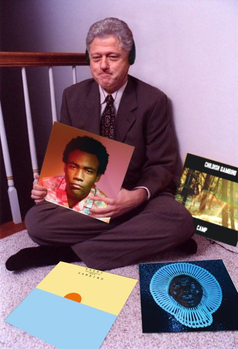 a man sitting on the floor holding two records and an album in front of him