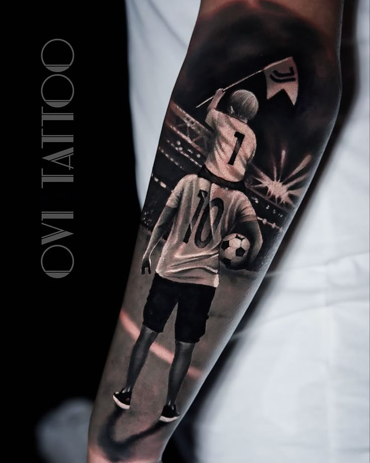 a man's arm with a black and white photo on it that has an image of a soccer player holding a ball