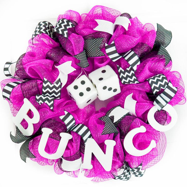 the word bunc spelled out with dices in front of a purple mesh wreath