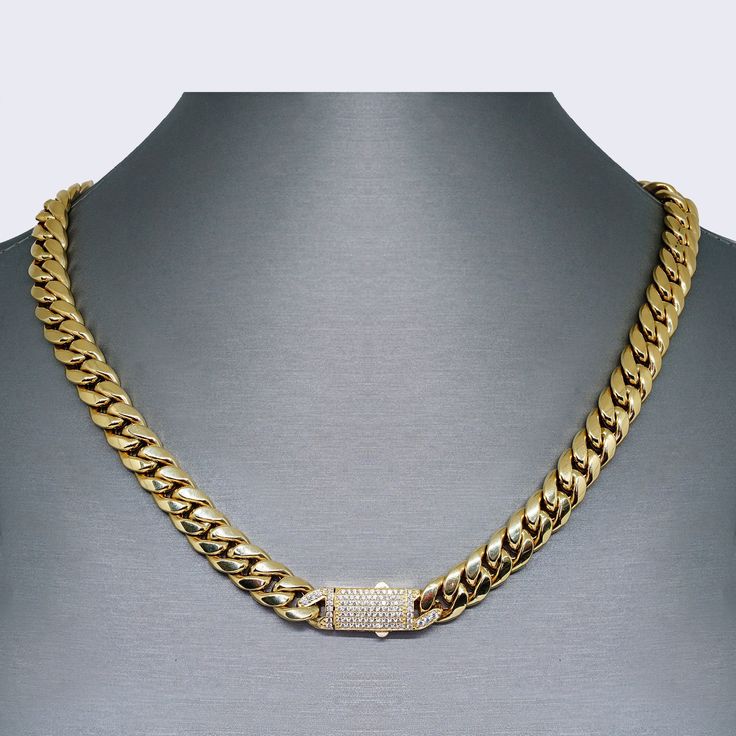 This 14K Cuban Chain Link with CZ Choker Set is the perfect addition to any jewelry collection. Made with high-quality 14K gold, this set exudes luxury and elegance. The necklace measures 18 inches in length and has a thickness of 9mm, while the bracelet measures 7 inches in length and also has a thickness of 9mm. The intricate chain link design adds a touch of sophistication to the set, while the sparkling CZ stones add a touch of glamour. This versatile set can be worn together for a statement Gold Cuban Chain, Link Design, Choker Set, 14k Gold Necklace, Cuban Chain, Cz Stone, Chain Link, Cubic Zirconia, Jewelry Collection