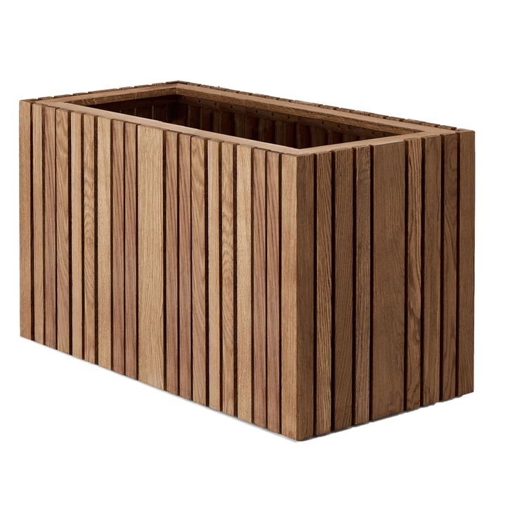 a wooden planter sitting on top of a white surface