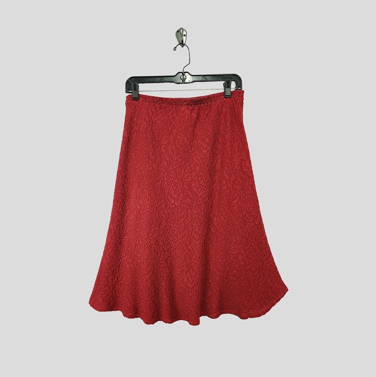 Indulge in luxurious elegance with our Red embossed silk skirt. It boasts an elastic waist for comfort, cut on the bias for a flattering fit, and falls gracefully at knee length. Product details: Size 2 fits size 8-14 Length: lower calf Material: 100% Textured Silk Made in California Hand dyed Printed Silk Skirt, Silk Tunic, Silk Print Dress, Silk Jacket, Silk Pants, Silk Skirt, Knee Length Skirt, Silk Top, Silk Printing