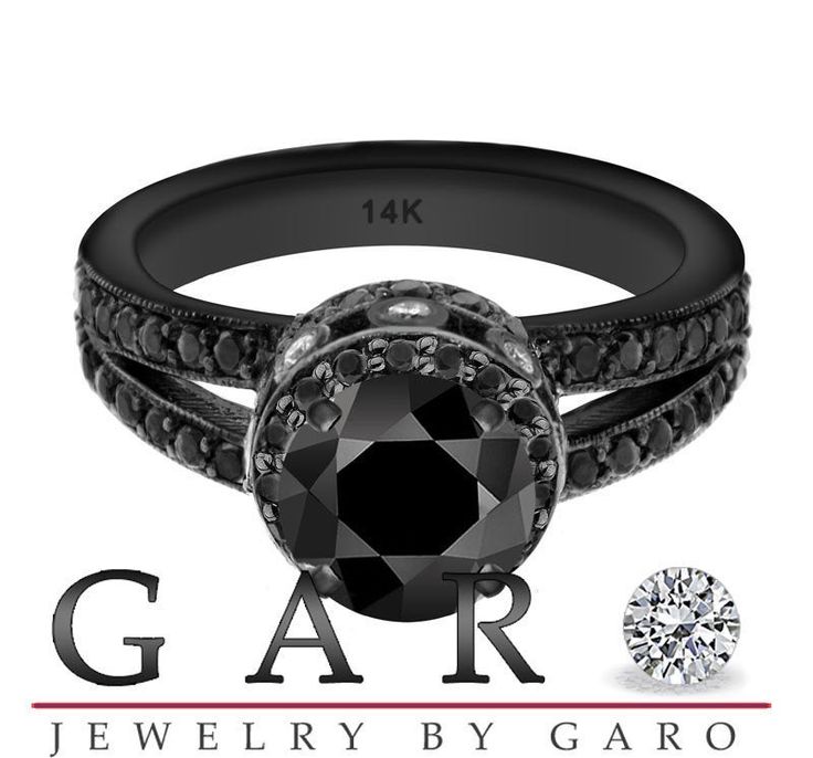 a black diamond ring with the words gar jewelry by garo written below it