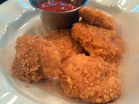 fried food on a plate with dipping sauce