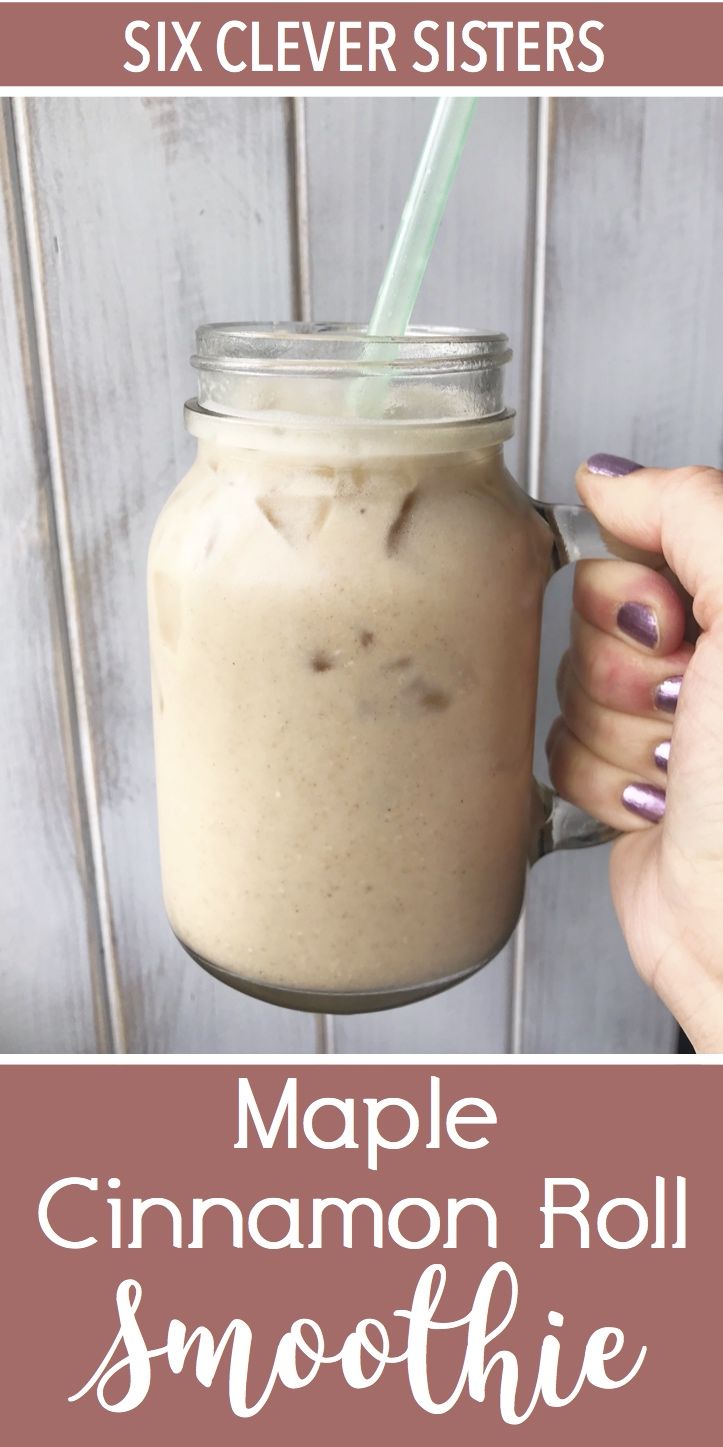 a person holding a mason jar with cinnamon roll smoothie in it and text overlay that says maple cinnamon roll smoothie