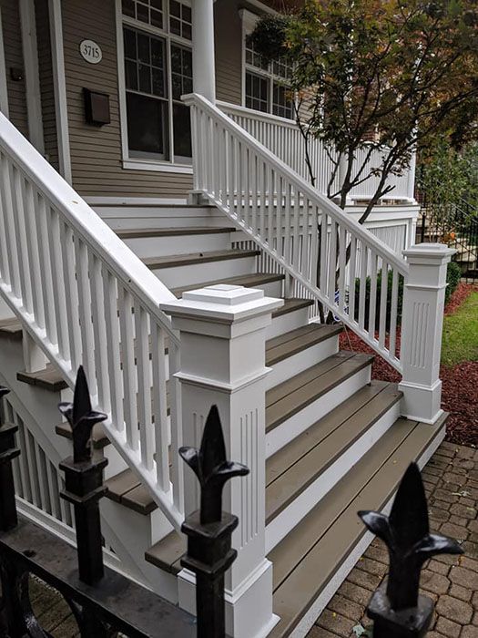 the front steps and railings of a house