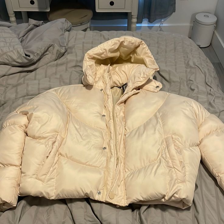 Never Worn. Has Tags Trendy Cream Hooded Outerwear, Trendy Cream Outerwear For Cold Weather, Cream Puffer Jacket For Spring, Hooded Beige Puffer Jacket For Spring, Trendy Winter White Puffer Jacket For Spring, Cream Puffer Jacket With Pockets For Spring, Trendy Beige Puffer Jacket For Spring, Trendy Cream Outerwear For Spring, Spring Cream Puffer Jacket