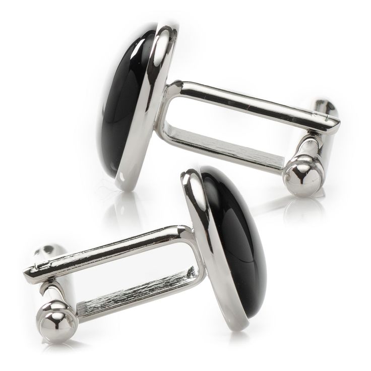 Classic and chic, our Silver and Onyx Cufflinks grant an immediate ensemble boost to your formal wardrobe. Smooth, deep Onyx discs nestle inside silver-finished settings for a simple, classic look suitable for any event. The expert craftsmanship of our base metal cufflinks ensures long-lasting durability. Pairs perfectly with our Onyx Inlaid Tie Clip. Elegant Black Cufflinks For Business, Adjustable Black Cufflinks For Business, Sleek Silver Jewelry For Formal Occasions, Sleek White Gold Jewelry For Formal Occasions, Classic Metal Jewelry For Business, Elegant Adjustable Silver Cufflinks, Classic Black Business Cufflinks, Elegant Formal Clip-on Cufflinks, Classic Polished Cufflinks For Formal Wear