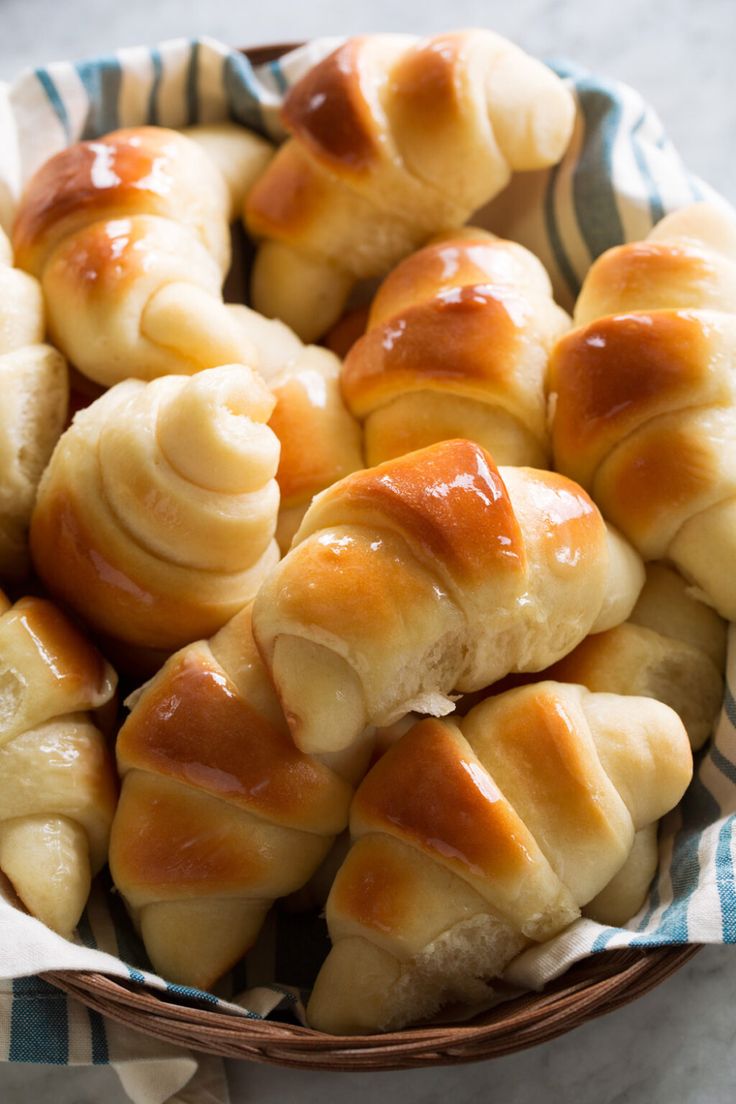 a basket filled with rolls covered in caramel glaze