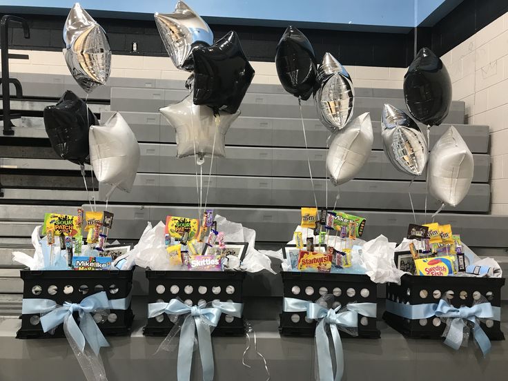 balloons and streamers are hanging from the bleachers