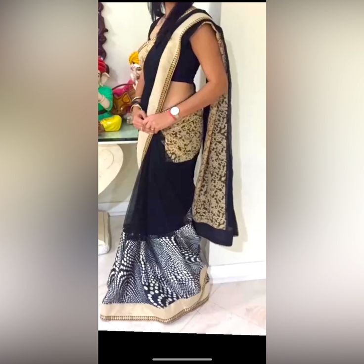 A Beautiful Black And Modern Print Saree With Some Embroidery, Worn For Two Hours. Black Organza Choli For Festive Occasions, Elegant Embroidered Black Pre-draped Saree, Elegant Black Embroidered Pre-draped Saree, Elegant Black Organza Choli, Black Silk Saree With Resham Embroidery, Black Silk Pre-draped Saree With Resham Embroidery, Black Organza Sets With Zari Work, Black Organza Choli With Dupatta, Black Organza Pre-draped Saree With Sheer Dupatta