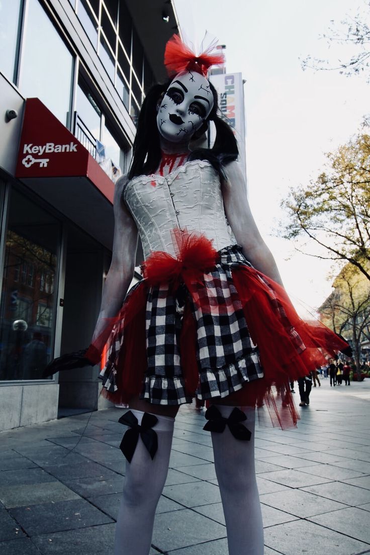 a woman dressed up as a clown on the street