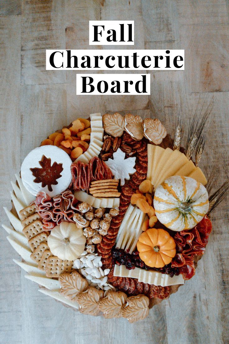 the fall charcuterie board is displayed on a table