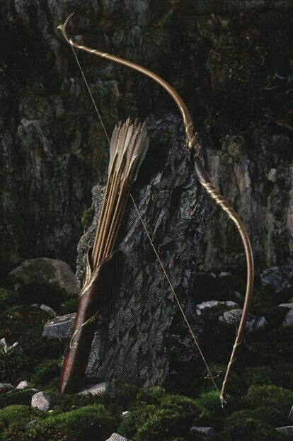 a bow and arrow on the side of a rock