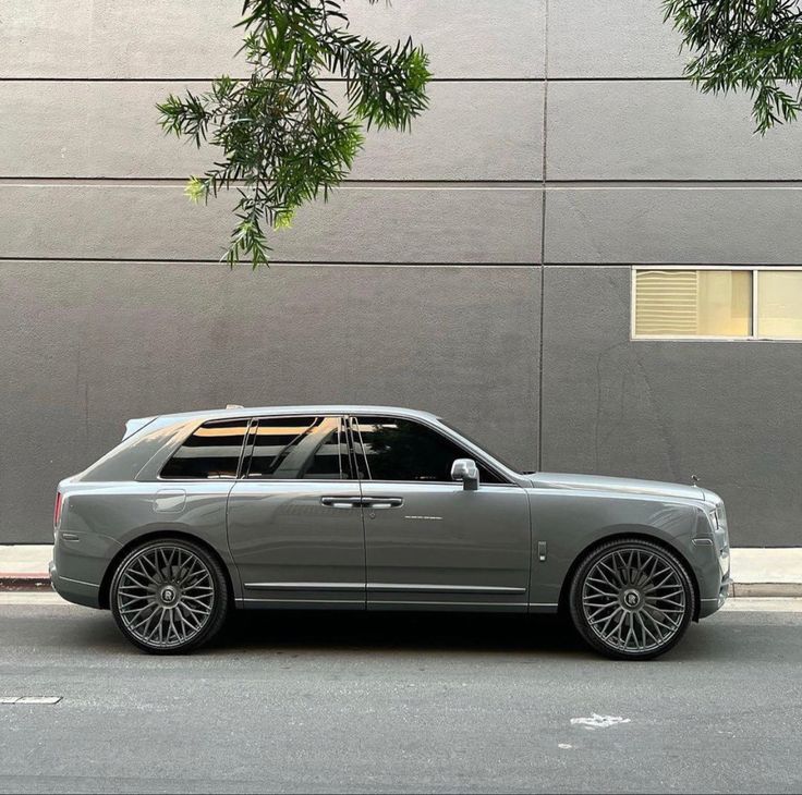 a silver car parked on the side of the road