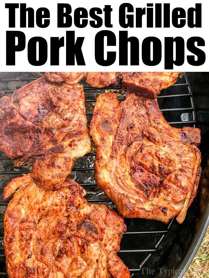 the best grilled pork chops on the grill with text overlay that reads, the best grilled pork chops