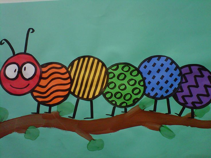 the very colorful caterpillars are on the tree branch painted with acrylic paint