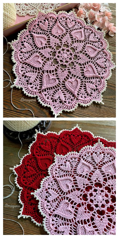 two crocheted dois sitting on top of a wooden table