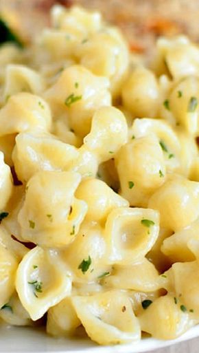 a close up of a plate of macaroni and cheese