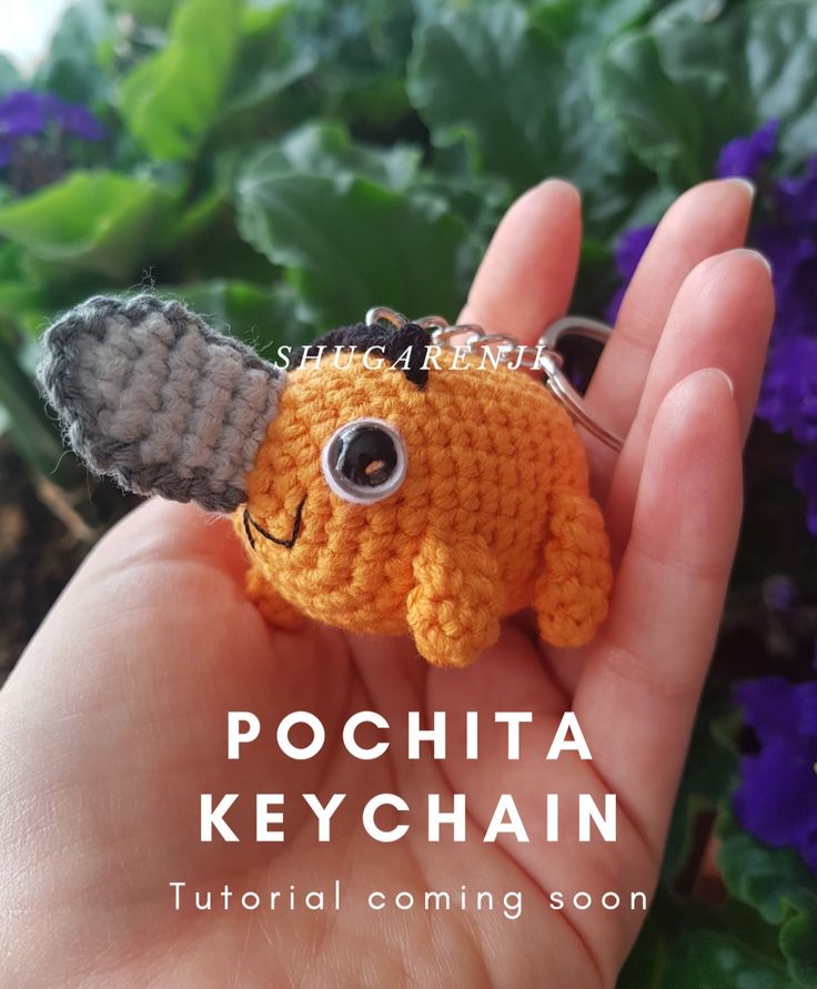 a small crocheted keychain with an elephant on it's head