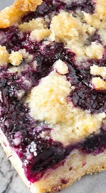 a piece of blueberry pie sitting on top of a table