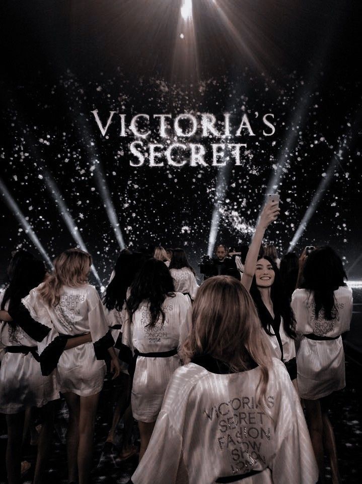 the victoria's secret show is being filmed on stage with people dressed in white