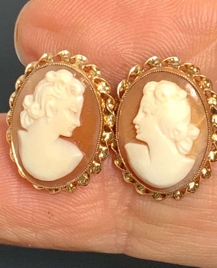 "Such a precious pair of vintage hand carved shell cameo stud earrings. They are right and left facing with threaded posts surrounded by 10kt yellow gold twist bezels. Each earring measures 5/8\" long by 1/2\"wide. The pair weighs 2.4dwt." Monet's Garden, Cameo Earrings, Pearl And Diamond Ring, Antique Pendant, Carved Shell, Yellow Gold Earring, Antique Diamond, Cultured Pearls, 14kt Gold