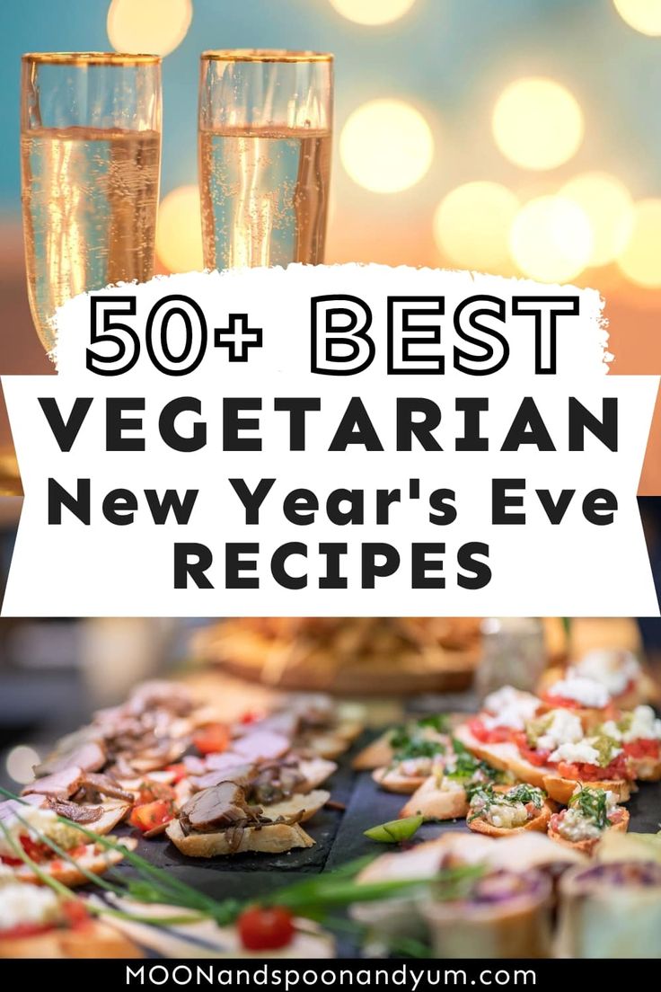 a table topped with food and two glasses filled with champagne