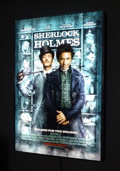 a movie poster with two men standing next to each other