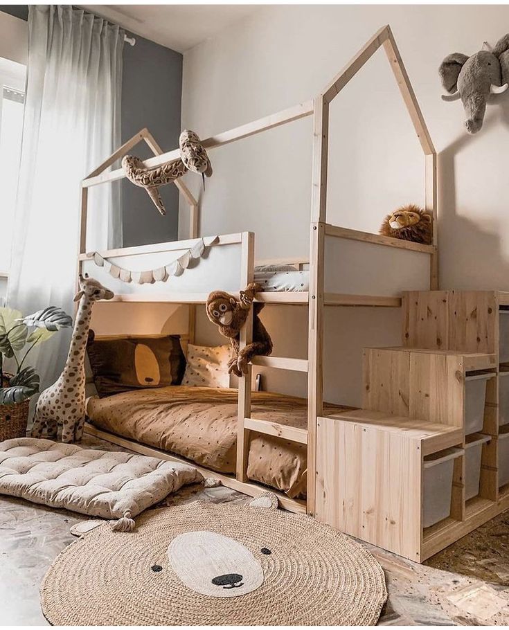 a child's bedroom with bunk beds and stuffed animals