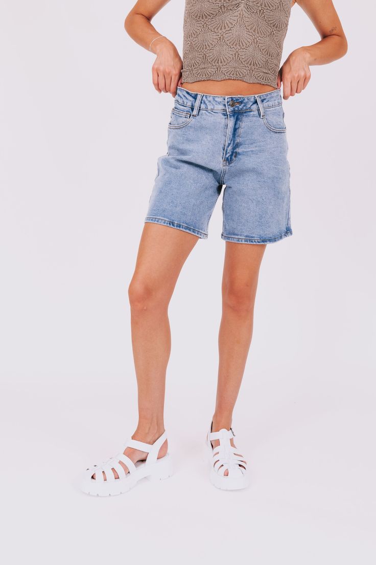 Rock your style with the Never Be Me Shorts! These stretchy, high waist Bermuda mom shorts are versatile and comfortable. Never settle for anything less than the best in these must-have bottoms. Details Stretchy High waist Bermuda mom shorts Sizing Approximate measurements: SIZE LENGTH/INSEAM WAIST Small 16/6.5" 28" Medium 17/7" 32" Large 17/7" 34" XLarge 18/7.5" 36" Fabric has some stretchModel is 5’8 wearing small Material 87% Cotton 12% PolyesterHand wash coldHang to dry Summer Jeans With Built-in Shorts, Relaxed Fit Biker Shorts For Spring, Trendy Shorts With Built-in Shorts, High Waist Stretch Jean Shorts In Light Wash, High Waist Light Wash Stretch Jean Shorts, High Waist Stretch Light Wash Jean Shorts, Summer Jeans With Built-in Shorts In Short Length, Trendy Stretch Jean Shorts With Built-in Shorts, Trendy Stretch Jean Shorts With Short Legs