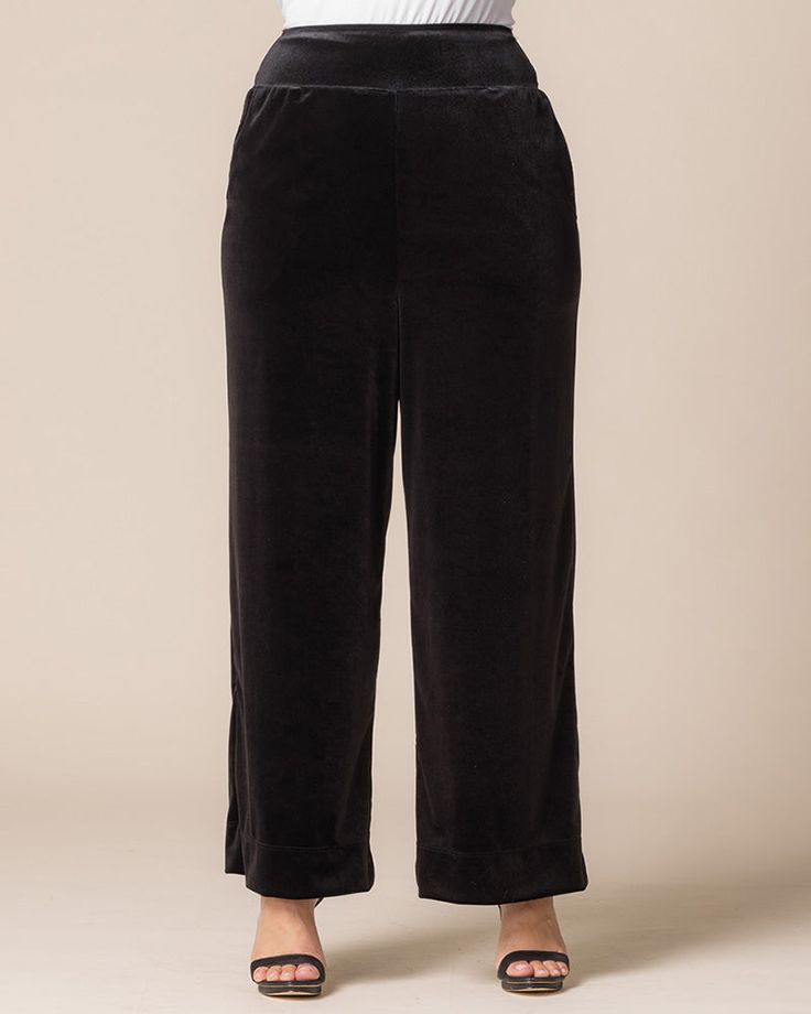 Step into a world of opulence with our Velvet Luxe Wide Leg Pants. These high-waisted, flowy palazzo pants are crafted from luxurious velvet that beautifully flatters your curves. Featuring convenient side pockets for your essentials, they seamlessly combine style and functionality. Perfect for special occasions, holiday parties, or formal events, these versatile plus size pants elevate any outfit. Whether you’re dancing the night away or enjoying an elegant dinner, you’ll feel effortlessly styl Chic Velvet Wide Leg Pants, Chic Velvet Trousers, Chic Wide-leg Velvet Pants, Elegant Velvet Trousers, Velvet Bottoms For Fall Loungewear, Fall Velvet Bottoms For Loungewear, Fall Velvet Loungewear Bottoms, Chic High-waisted Velvet Pants, Elegant Straight Velvet Pants