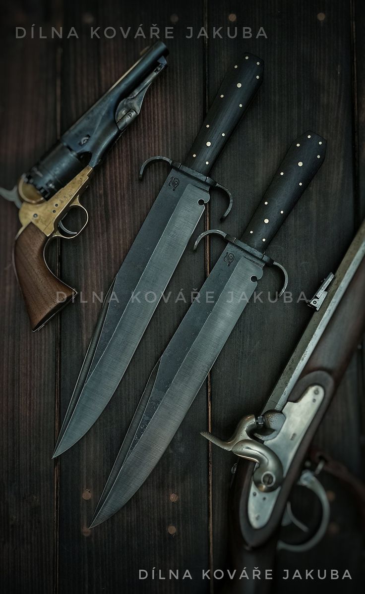 three different types of knifes and knives on top of a wooden table next to each other