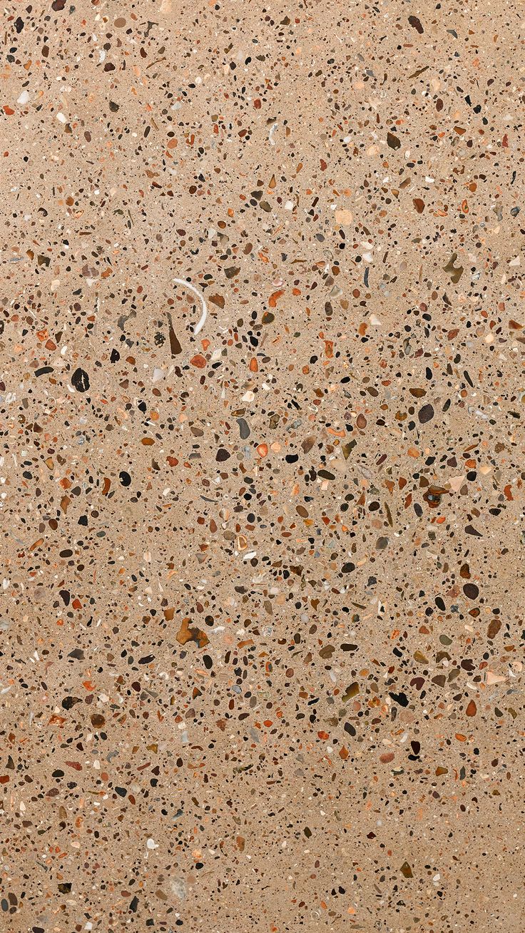 the floor is made up of many different colored rocks and gravel, including small pebbles