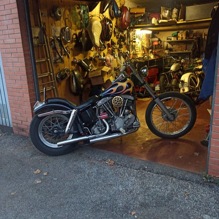 a motorcycle parked in front of a garage