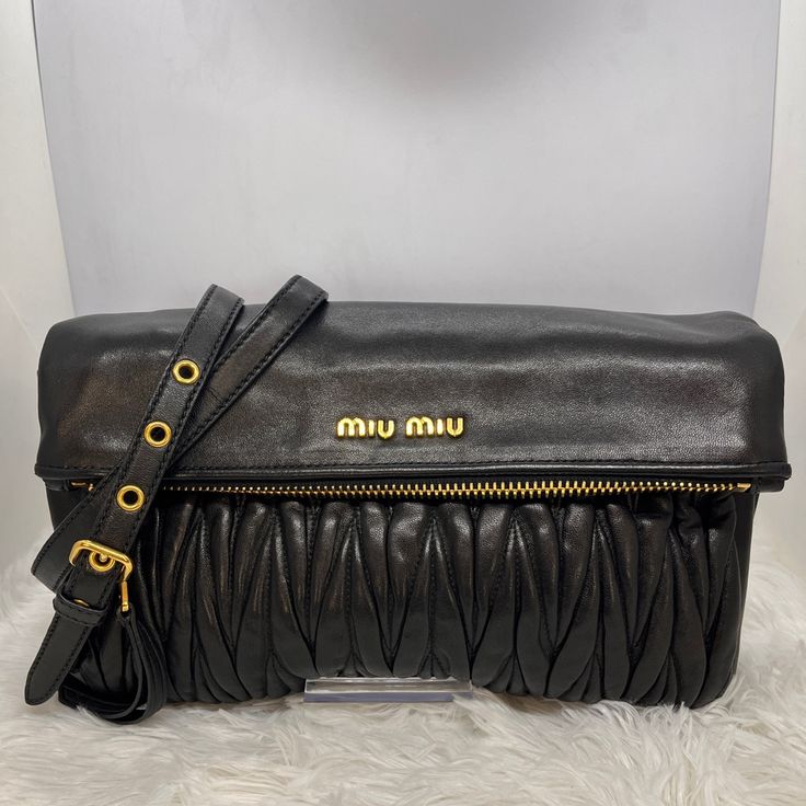 Authentic Miu Miu Matelasse Leather Bag Medium. Excellent Condition, Faint Scuffs And Creasing. Please See All The Photos Designer Crossbody Clutch With Top Carry Handle, Designer Clutch With Top Carry Handle, Luxury Miu Miu Shoulder Bag With Top Carry Handle, Miu Miu Formal Shoulder Bag With Detachable Strap, Formal Miu Miu Shoulder Bag With Detachable Strap, Designer Clutch With Detachable Strap For Shoulder Wear, Designer Clutch With Removable Pouch Crossbody, Miu Miu Crossbody Shoulder Bag With Detachable Strap, Miu Miu Evening Shoulder Bag With Top Carry Handle